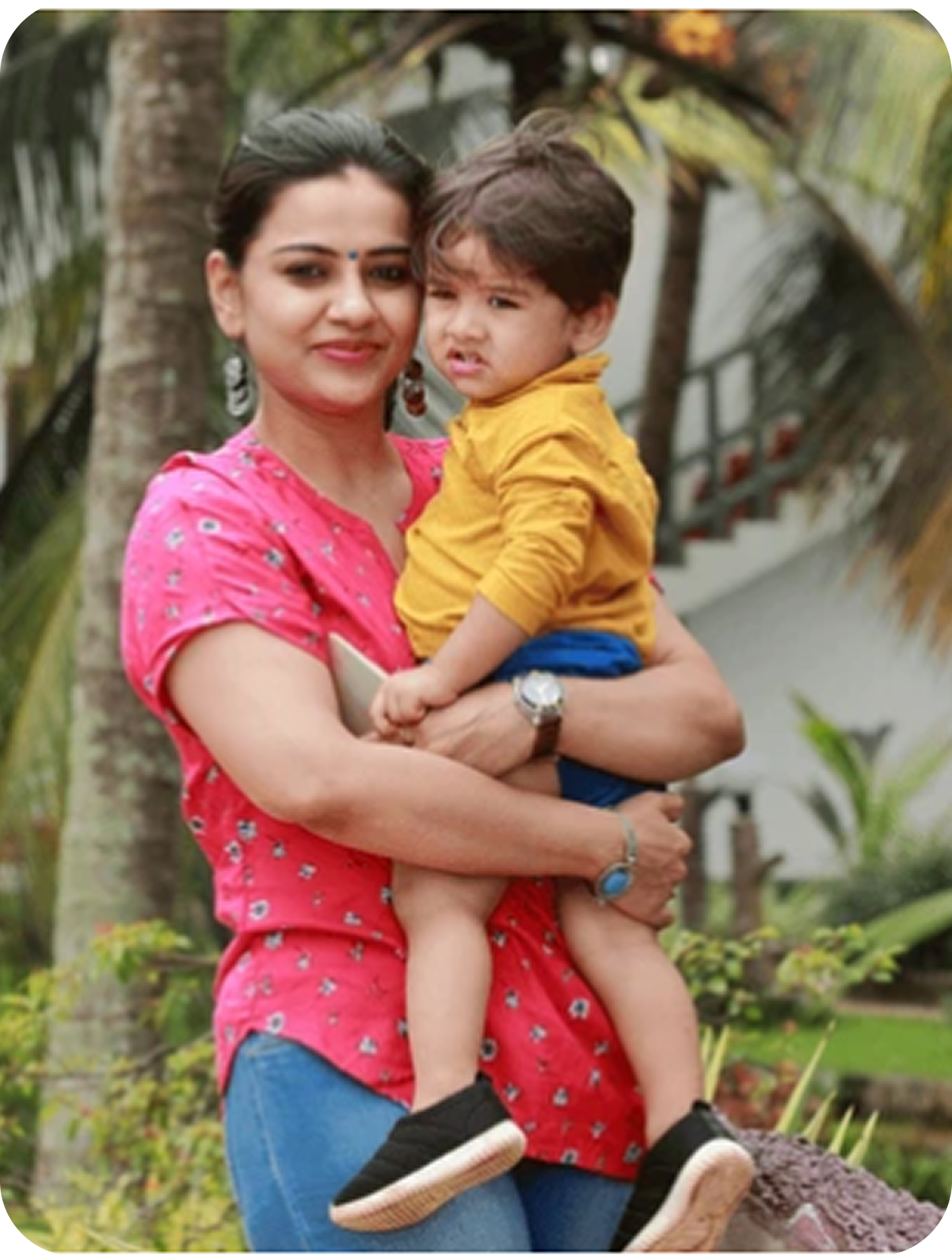 Mother holding her child outdoors