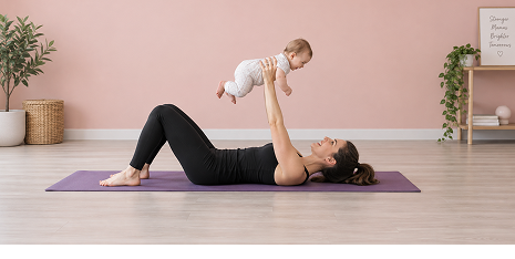 Woman doing a bridge exercise on a mat while holding her baby