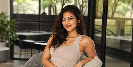 Woman smiling, representing period relief and wellness